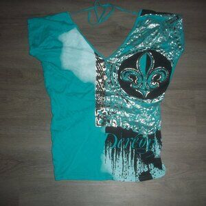 DEREON sexy blouse. Bling on front. Twist knot low cut back.size large